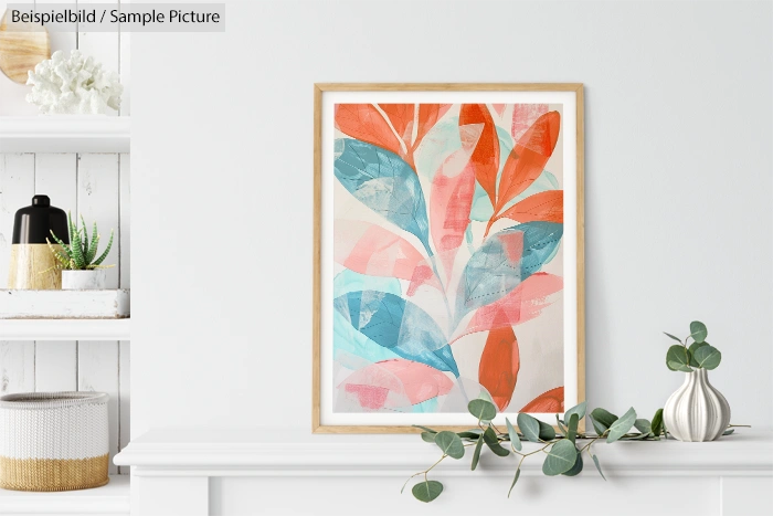 Framed abstract artwork with blue and orange leaf patterns on a white wall above a mantel with vases and greenery.