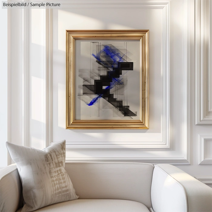 Modern living room with abstract framed artwork featuring blue and black geometric pattern on the wall above a white sofa.