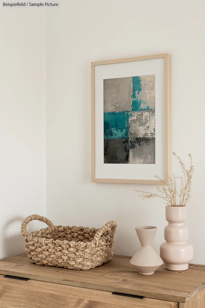 Minimalist room with abstract painting, wicker basket, and ceramic vases on a wooden cabinet, neutral color palette.