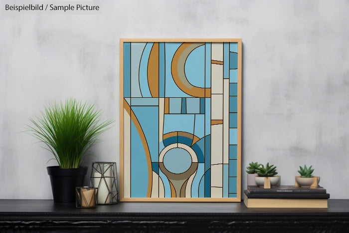 Abstract geometric artwork in blue, gold, and beige with plants and books on a shelf against a gray wall.