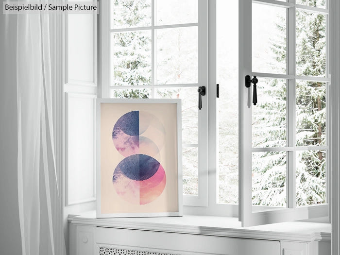 Framed abstract art with pink and blue circles on windowsill, snowy landscape outside.