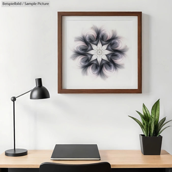 Home office desk with laptop, lamp, plant, and framed abstract artwork featuring swirling patterns on the wall.