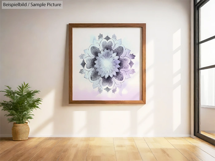 Framed mandala art on wall, sunlight from window, plant on wooden floor.