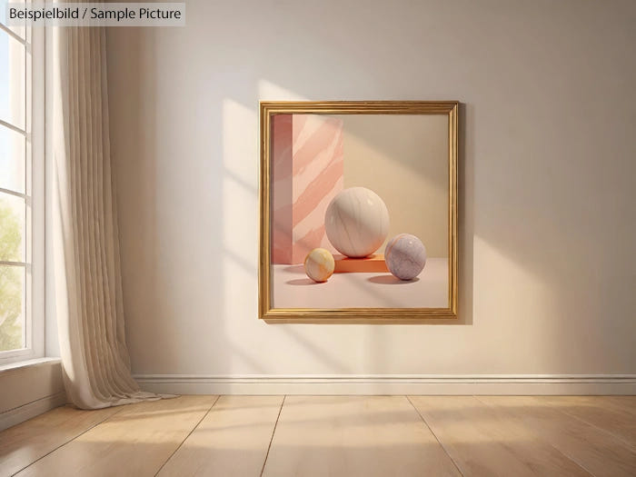 Framed still life painting of three spheres on a pastel background, hung on a sunlit wall next to a curtained window.