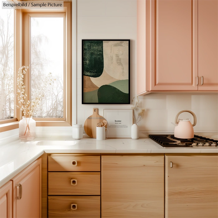 Modern kitchen with pink cabinets, marble countertops, and a green abstract painting on the wall.