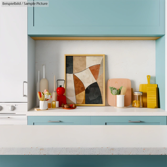 Modern kitchen with light blue cabinets, abstract painting, and colorful utensils on countertop.