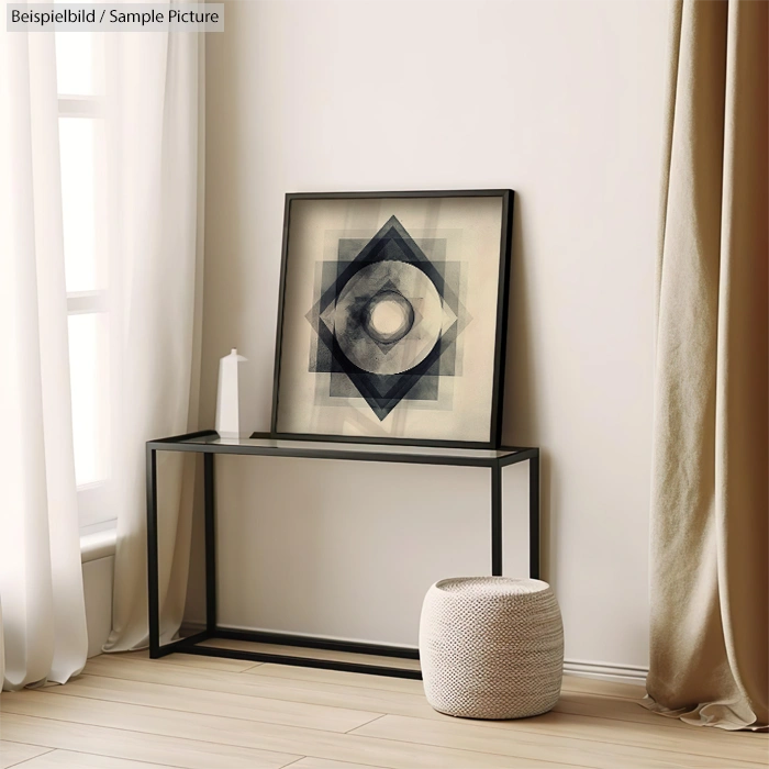 Minimalist room with geometric artwork on black console table, beige curtains, and a round woven basket on floor.