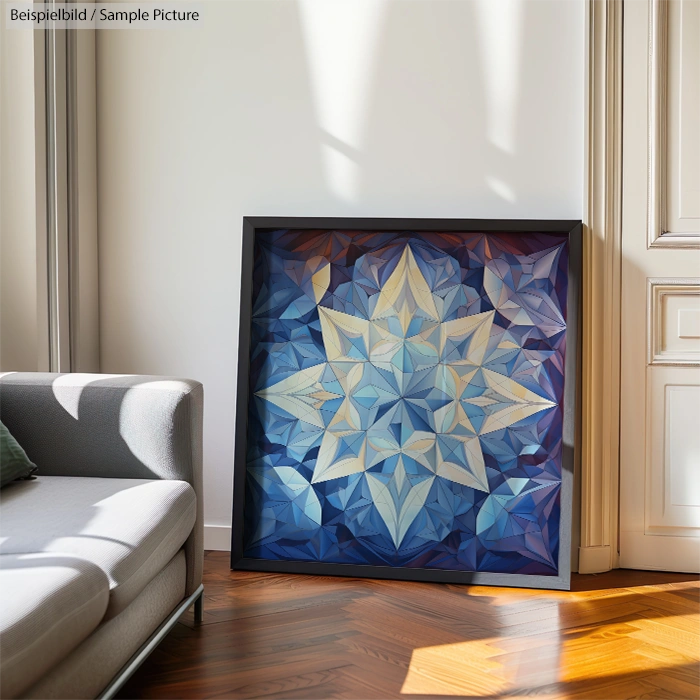 Fractal art of a star design in blue and white, framed and placed on wooden floor near a sofa and window.