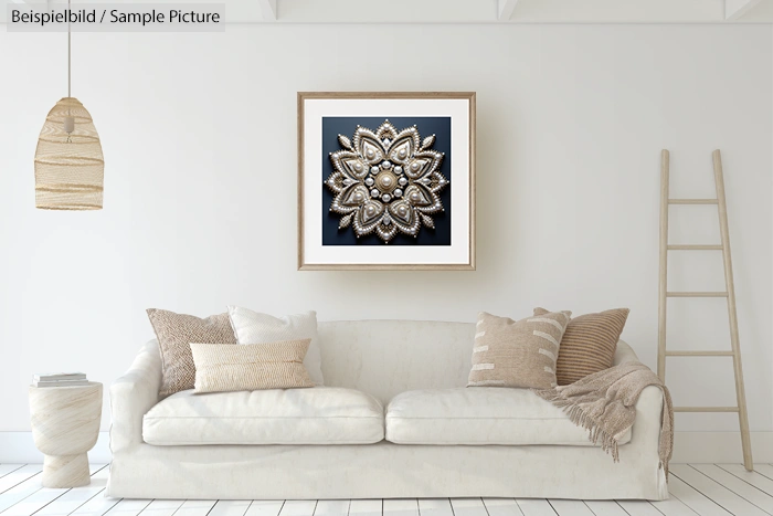 Cozy living room with beige sofa, pillows, and a mandala art piece on the wall.