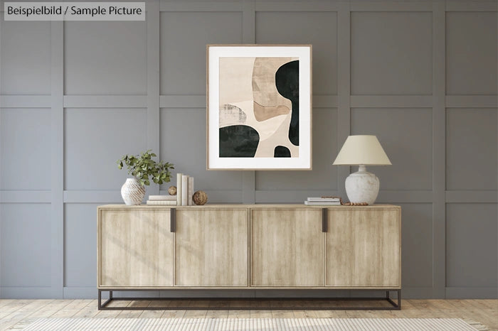 Modern living room with abstract painting, wooden sideboard, lamp, and plant.