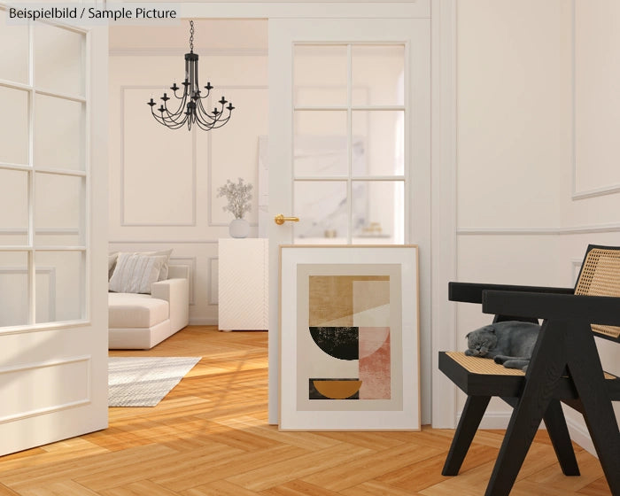 Modern living room with wooden flooring, abstract artwork, black chair, and chandelier.