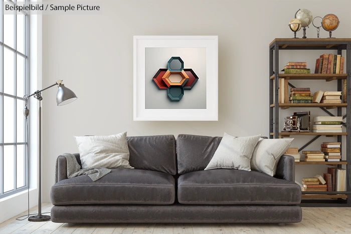 Modern living room with gray sofa, geometric artwork on wall, and bookshelf filled with books and decorative items.