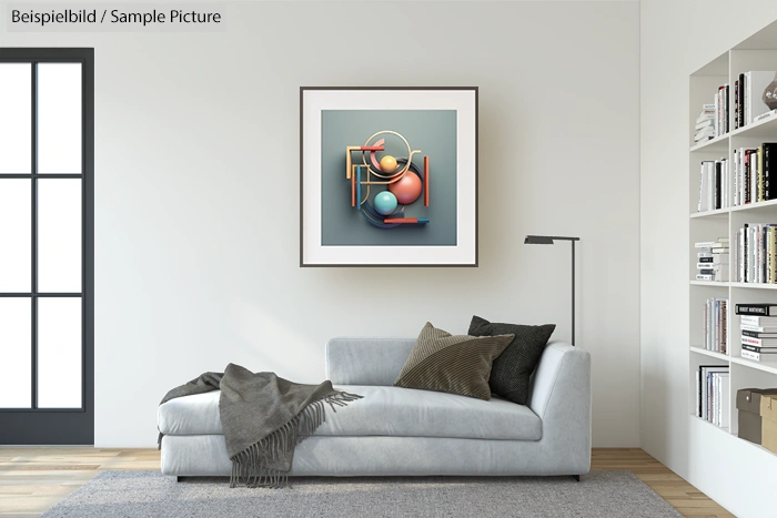 Modern living room with a light gray sofa, abstract geometric art on the wall, and a bookcase with various books.