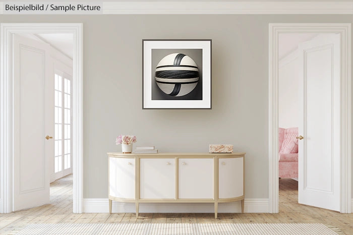 Modern hallway with light gray walls, white console table, and abstract painting above; natural light from French doors.