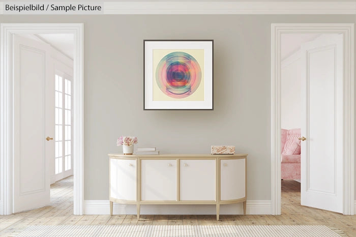 Modern hallway with abstract rainbow circle artwork above a white console table against a light gray wall.