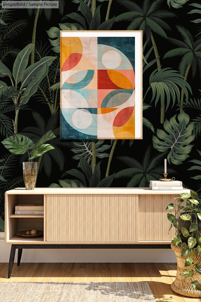 Mid-century modern decor with geometric art, tropical wallpaper, and wooden sideboard featuring plant accents.