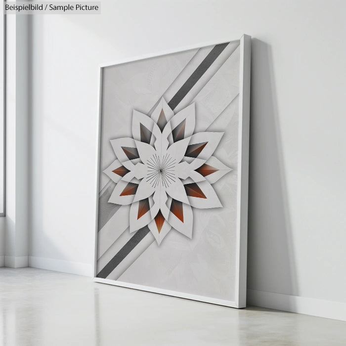 Geometric paper art on a canvas leaning against a white wall, featuring layered star shape with gray and orange accents.