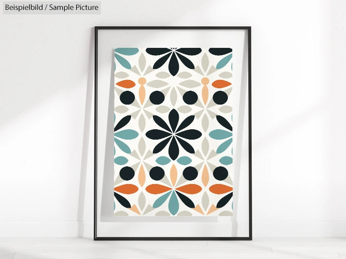 Framed geometric art print with colorful floral patterns in teal, orange, black, and gray on a light background.