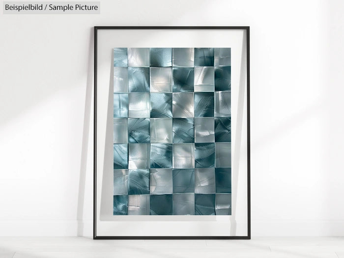 Framed abstract artwork with metallic teal squares, creating a reflective grid pattern against a light background.