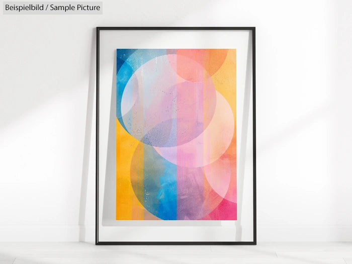 Framed abstract art with overlapping circles in vibrant colors like pink, blue, and yellow.