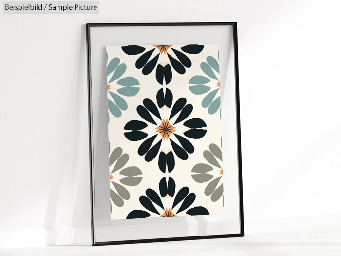 Framed geometric art print with symmetrical floral pattern in shades of blue, black, orange, and gray against white.