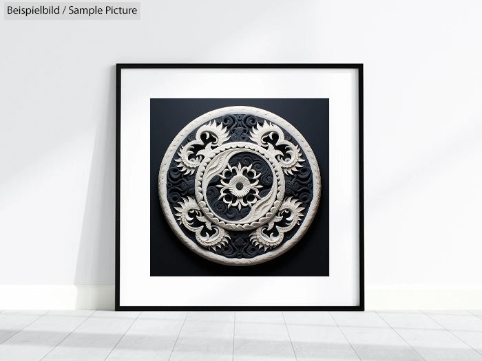 Ornate circular metal artwork with floral and spiral motifs framed in black against a white wall.