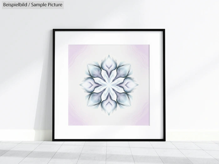 Framed geometric floral artwork with soft pastel colors, displayed on a white wall.