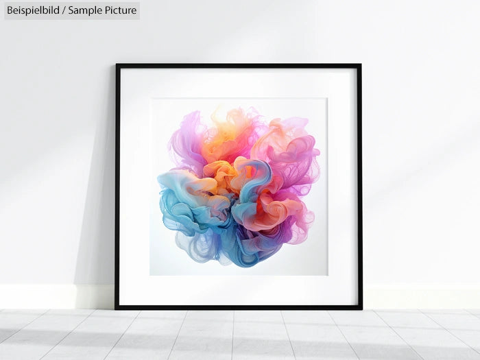 Framed abstract art with swirling pastel colors of pink, orange, and blue, displayed on a white wall.