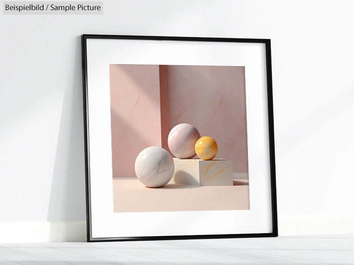 Minimalist framed artwork with spheres on plinths against a pale background in white and pastel colors.