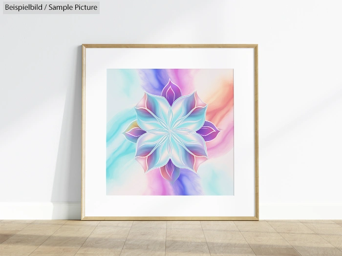 Framed floral mandala on a light wooden floor, featuring pastel blue, pink, and peach tones in a modern, abstract style.