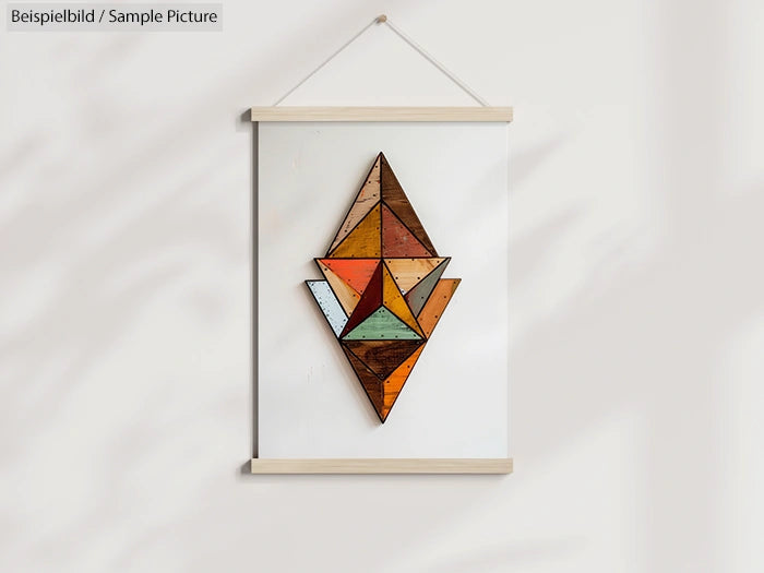 Geometric wooden wall art with colorful triangular shapes hanging on white wall.