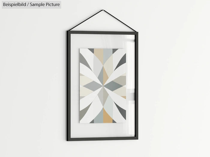 Framed geometric abstract art on a wall with neutral tones.