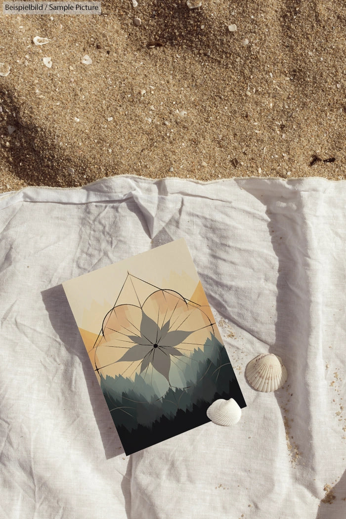 Geometric abstract art on card placed on sandy beach with seashells and white fabric.