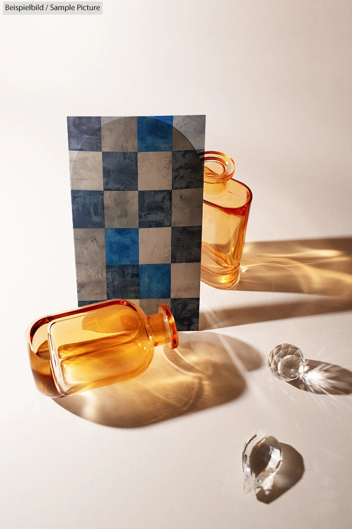 Amber glass bottles and a blue checkered card on a bright surface with crystal spheres casting shadows.