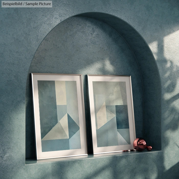 Two abstract paintings with geometric designs in blue and beige tones displayed in an arched niche with soft lighting.