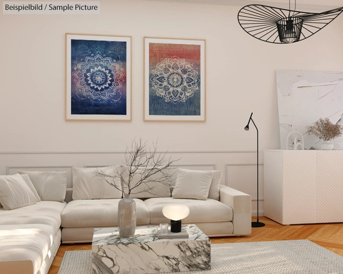 Modern living room with white sectional, two mandala art pieces, marble coffee table, and contemporary lighting.