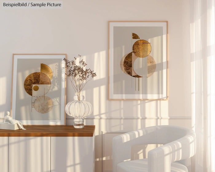 Minimalist room with abstract gold and white framed art, vase on wooden side table, and sunlight casting shadows.