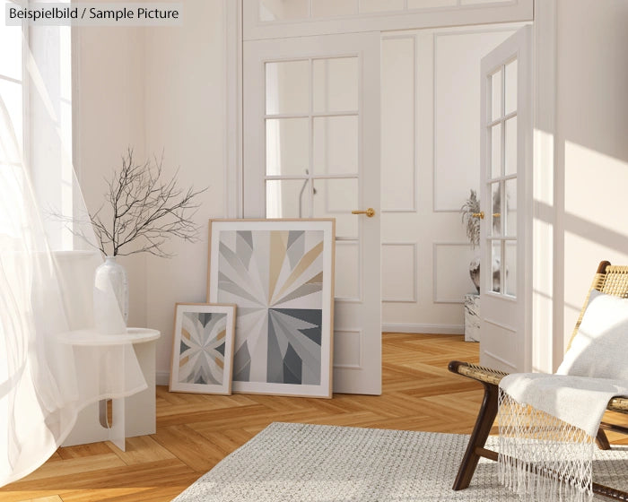 Bright room with parquet floor, minimal decor, two abstract paintings, a vase with branches, and a woven chair.