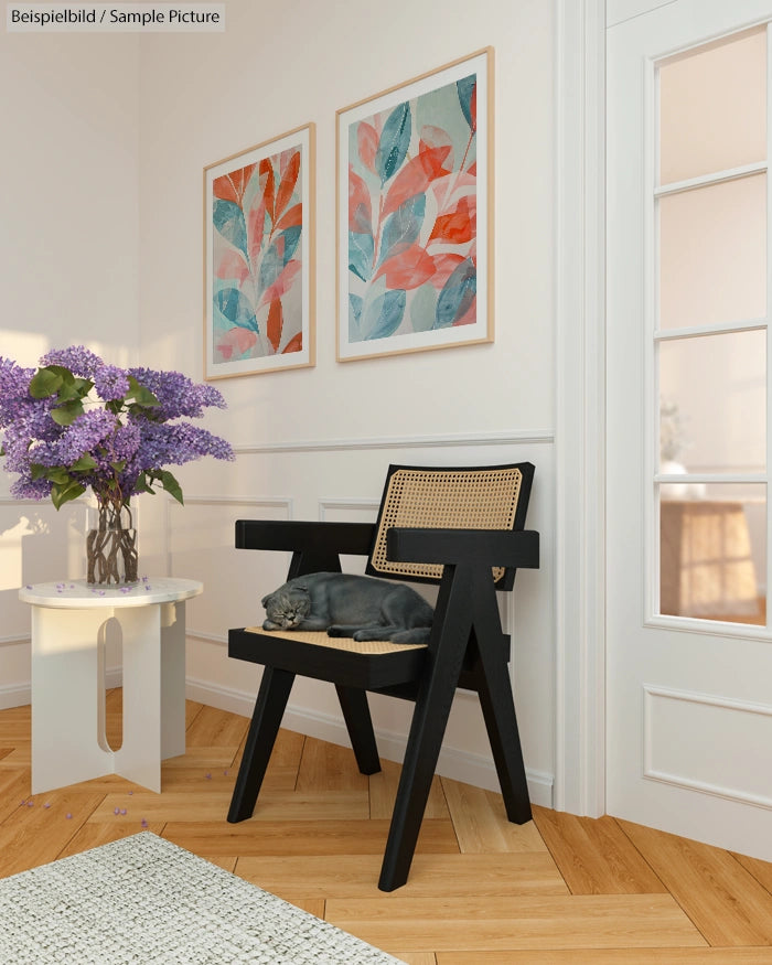 Cozy corner with a modern chair, sleeping cat, decorative flowers, and abstract leaf art on the wall.