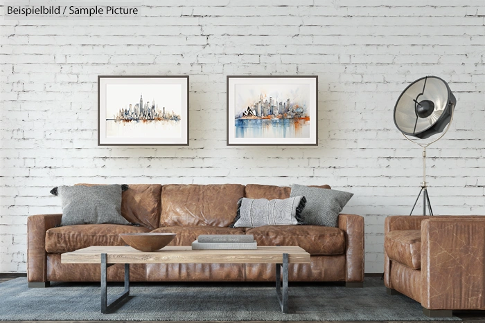 Modern living room with leather sofa, pillows, framed cityscape art, and industrial floor lamp on a white brick wall.