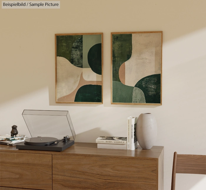 Minimalist room with wooden sideboard, record player, abstract art, vase, and books on a beige wall.