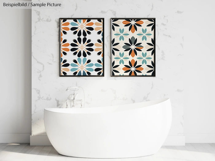 Modern bathroom with white oval bathtub and two colorful geometric art pieces on a marble wall.