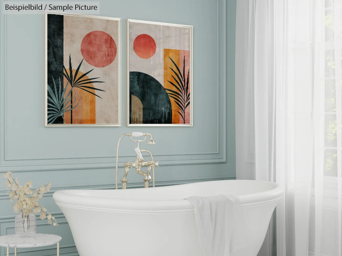 Elegant bathroom with a white freestanding tub, light blue walls, and abstract art featuring geometric shapes and palm leaves.