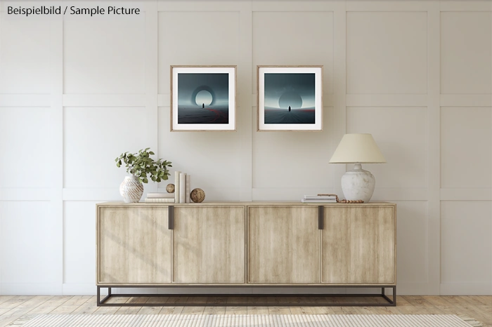 Modern living room with wooden sideboard, two framed artworks, and decorative items on top.