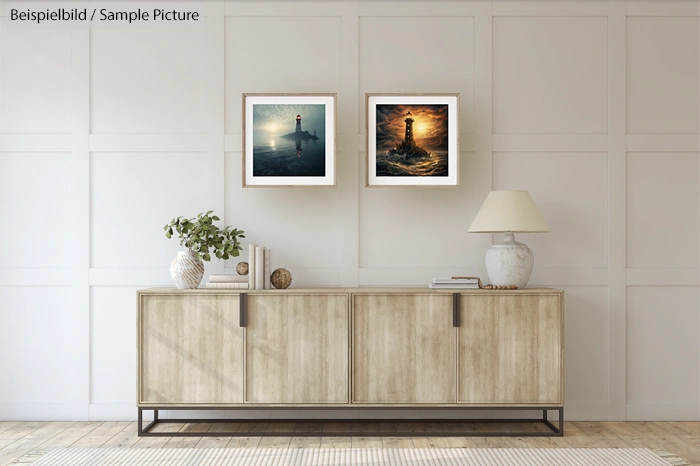 Modern living room with wooden sideboard, two framed lighthouse paintings, and a table lamp on the cabinet.