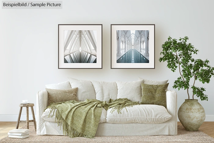 Modern living room with white sofa, green cushions, abstract wall art, and a large potted plant.