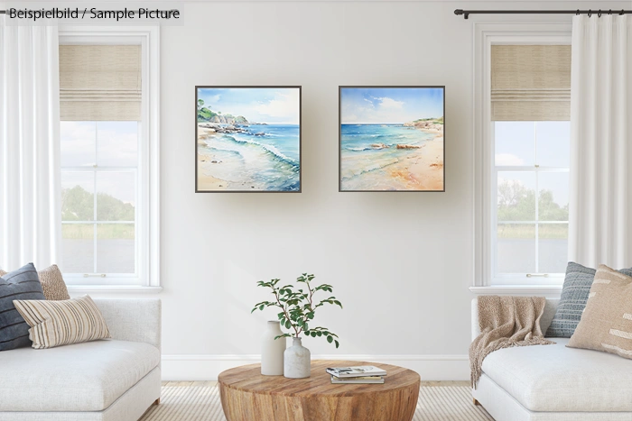 Bright living room with two beach paintings, two sofas, and a wooden coffee table with a potted plant.