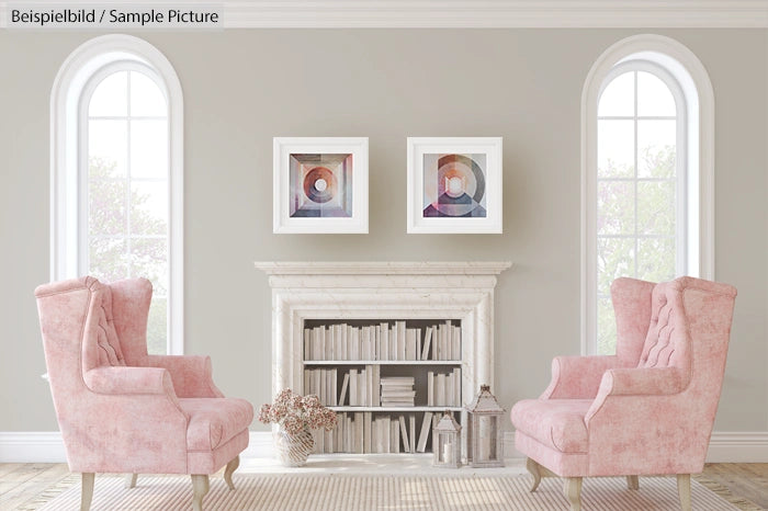 Elegant living room with two pink armchairs, a cream fireplace, and abstract artwork on gray walls.