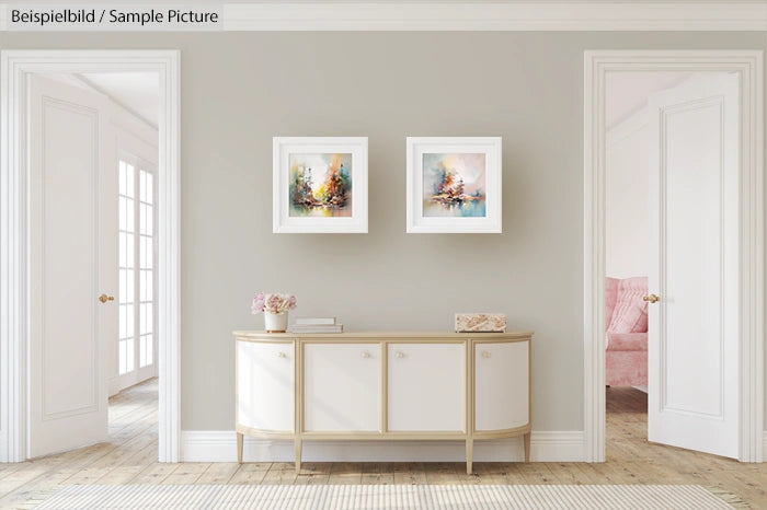 Elegant living room with light gray walls, white sideboard, two abstract paintings, and soft natural lighting.