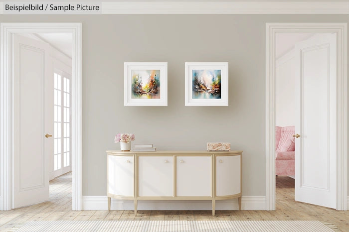 Modern living room with abstract art, white sideboard, neutral walls, and light wooden flooring.